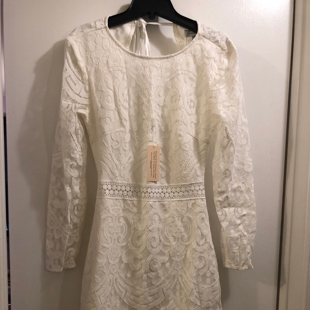 White dress. Open back. With beautiful design